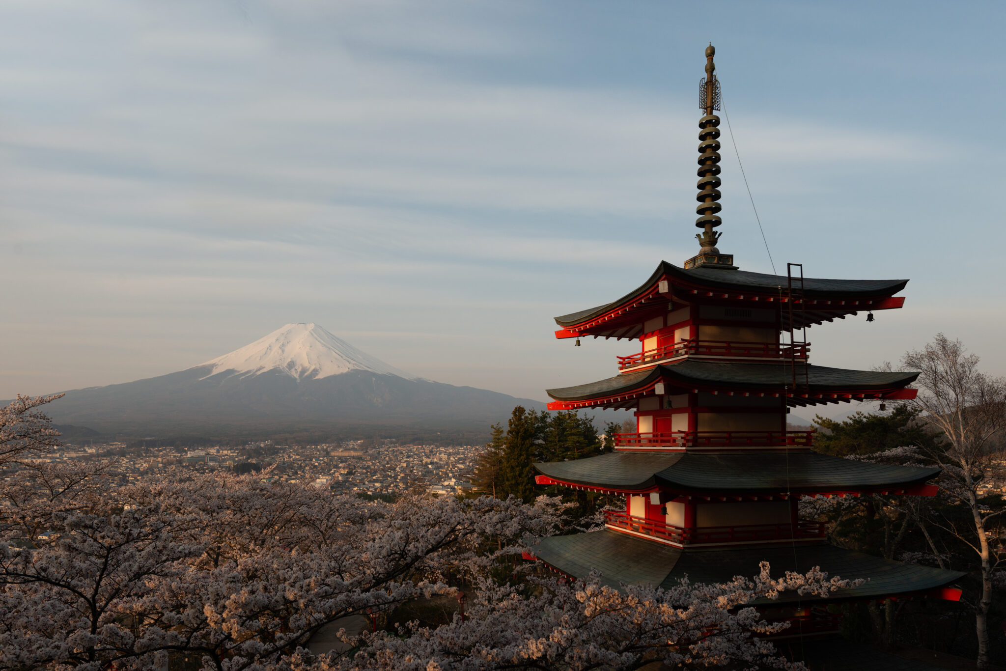 a pagoda with Mount Fuji in the background